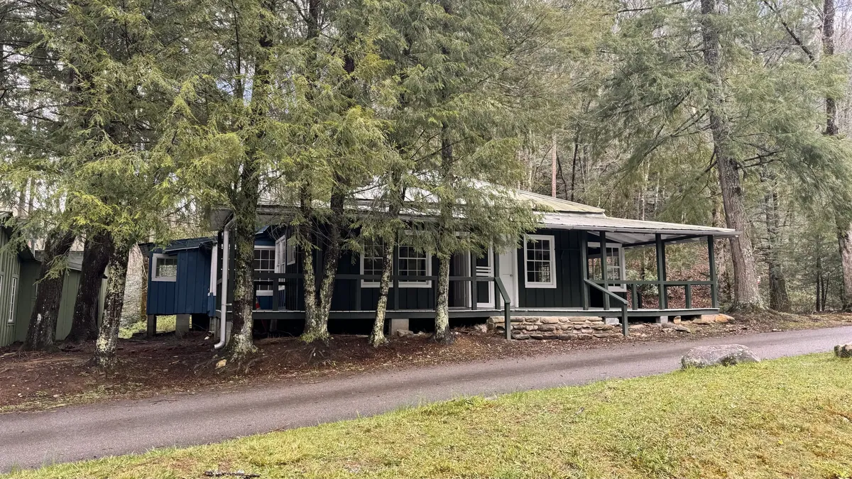 a house with trees around it Daisy Town at Elkmont