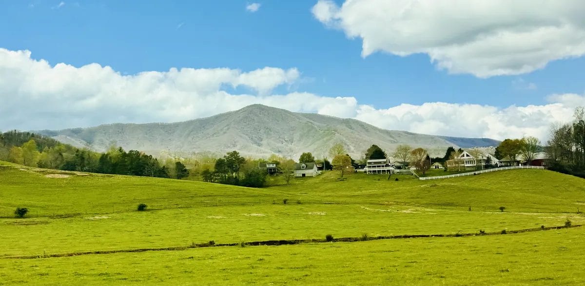 wears valley view of fields and mountains 